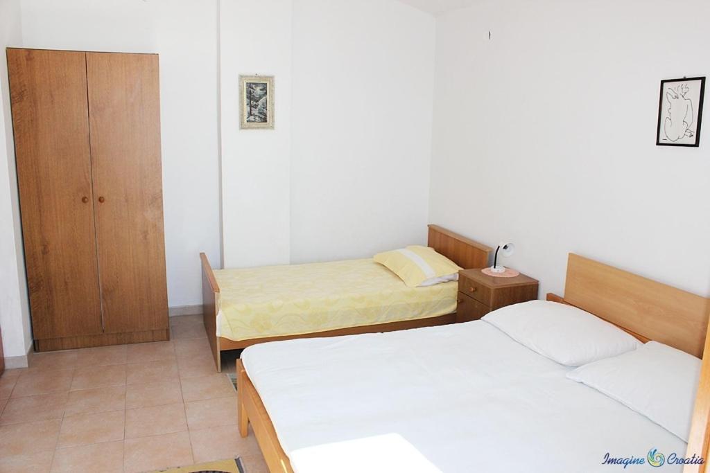 Posteľ alebo postele v izbe v ubytovaní Apartment in Pisak with sea view, balcony, air conditioning, Wi-Fi (4722-4)