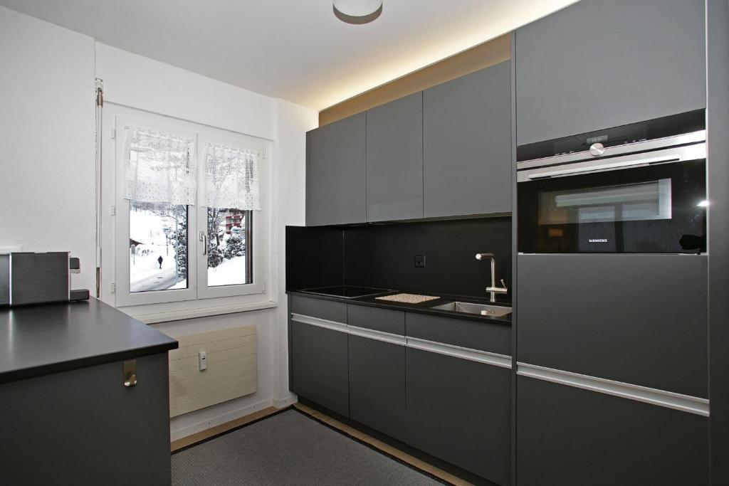 Kuchyň nebo kuchyňský kout v ubytování Baron / Baronesse Apartments