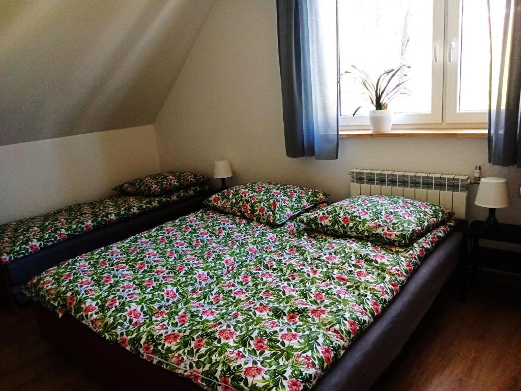 Posteľ alebo postele v izbe v ubytovaní Sowinka