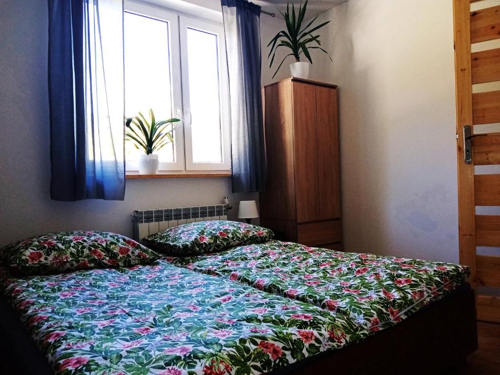 Posteľ alebo postele v izbe v ubytovaní Sowinka