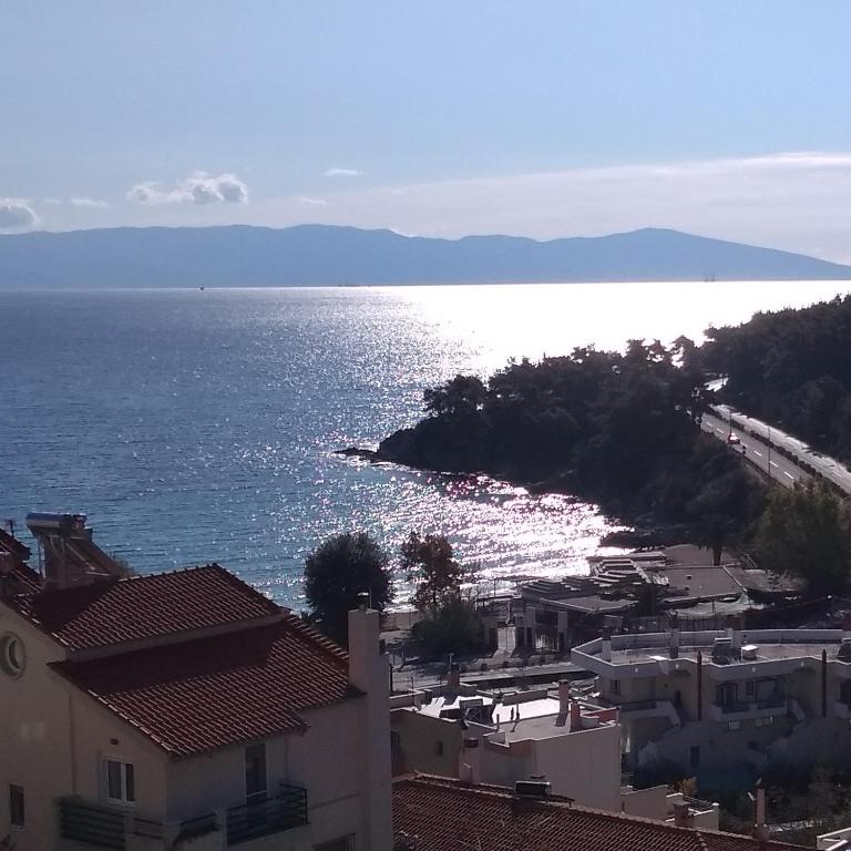 a view of the ocean with houses and buildings at Iris Deluxe Suites 2 in Kavála