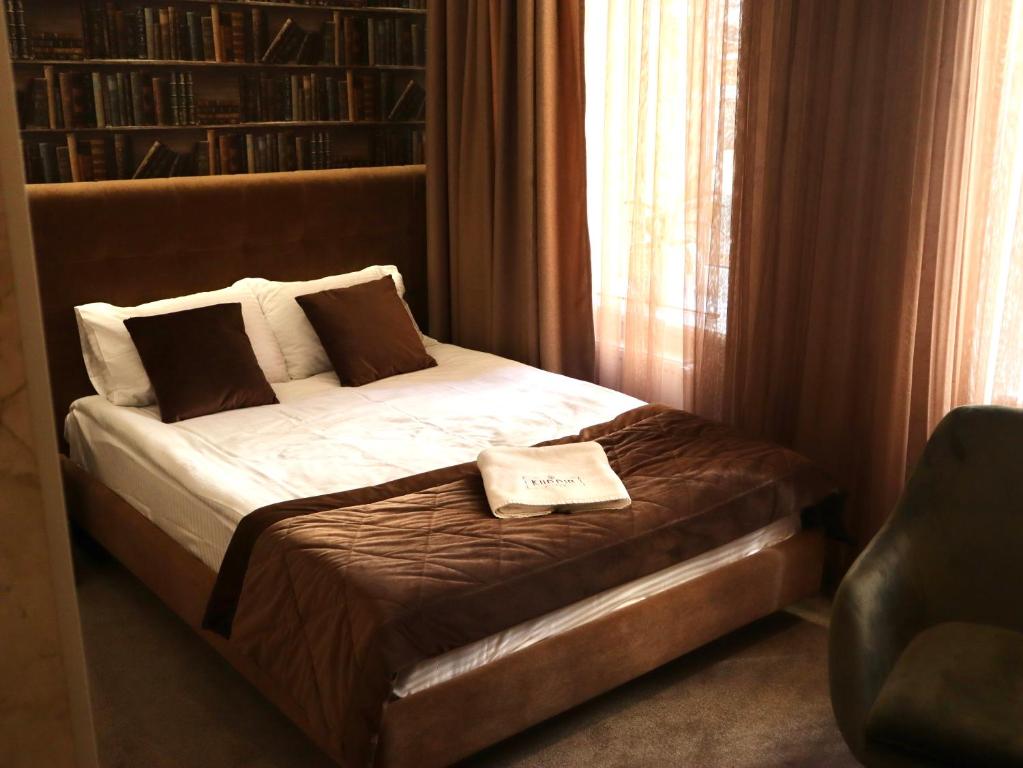 Postel nebo postele na pokoji v ubytování Kuprin Hotel