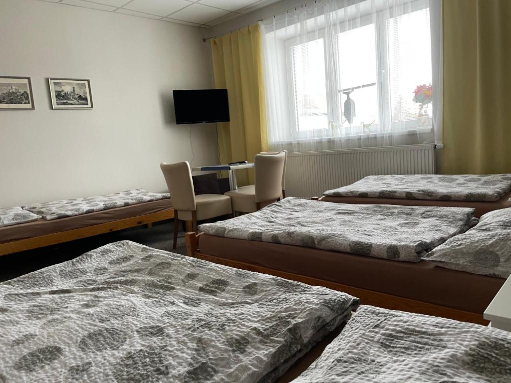 Voodi või voodid majutusasutuse Četnická stanice Hluboká toas