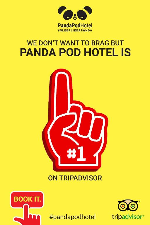 a hand with a peace sign on a yellow background at Panda Pod Hotel in Richmond