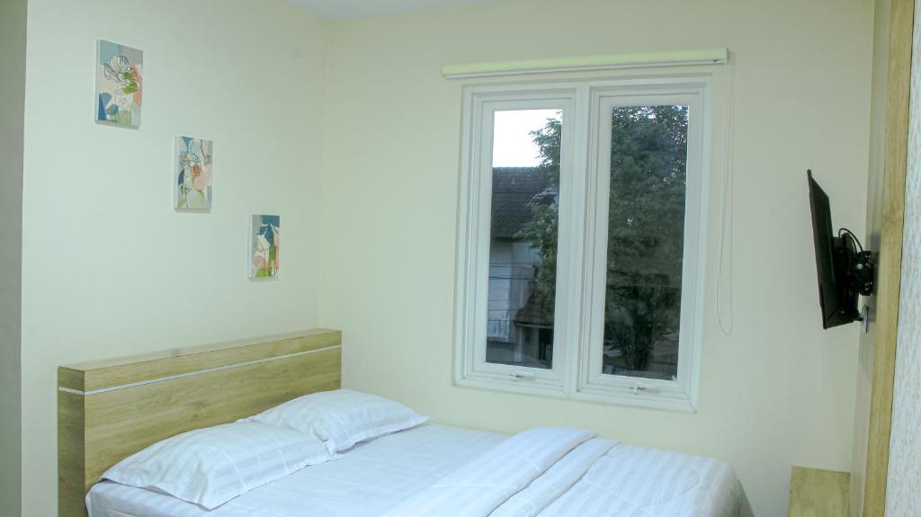 Postel nebo postele na pokoji v ubytování CASAKITA exclusive guest house