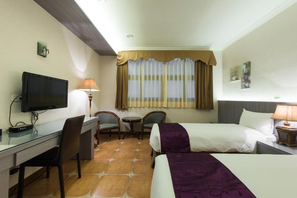 TV a/nebo společenská místnost v ubytování Kending Kaying Hotel