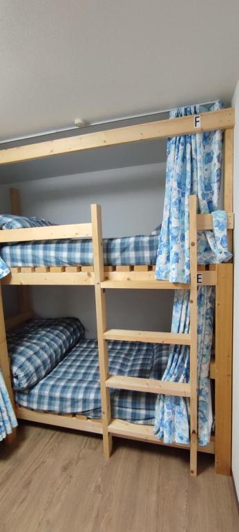 Postel nebo postele na pokoji v ubytování GUEST HOUSE TOKAI nagaragawa