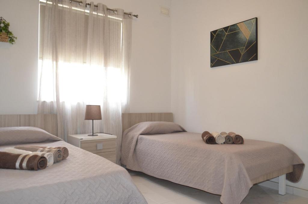 Postel nebo postele na pokoji v ubytování Lorenza Letting Apartment