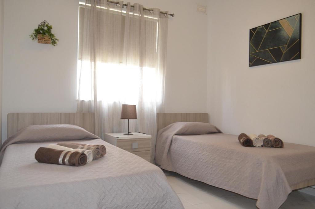 Postel nebo postele na pokoji v ubytování Lorenza Letting Apartment