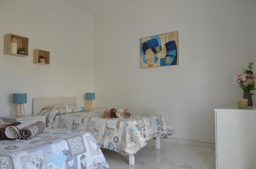 Postel nebo postele na pokoji v ubytování Lorenza Letting Apartment