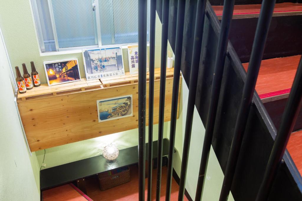 Postel nebo postele na pokoji v ubytování Shinagawa-shuku Guest House & Tours