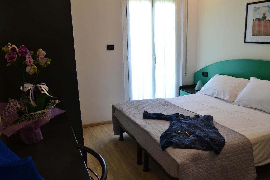 Postel nebo postele na pokoji v ubytování Hotel Tre Stelle