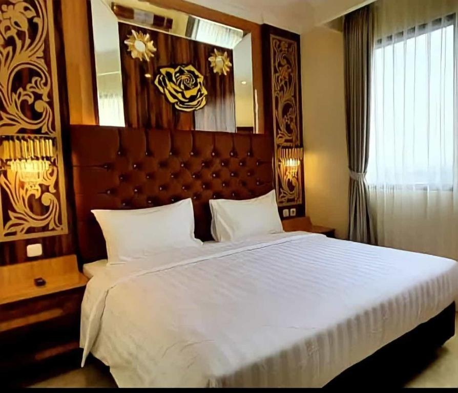 Postel nebo postele na pokoji v ubytování Hotel Daily Inn Bandung