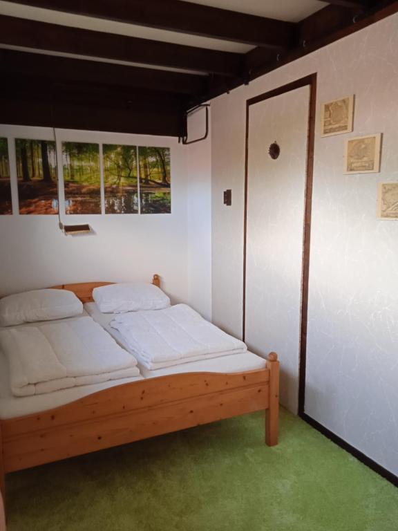 Postel nebo postele na pokoji v ubytování Vakantiehuis Friedeburg
