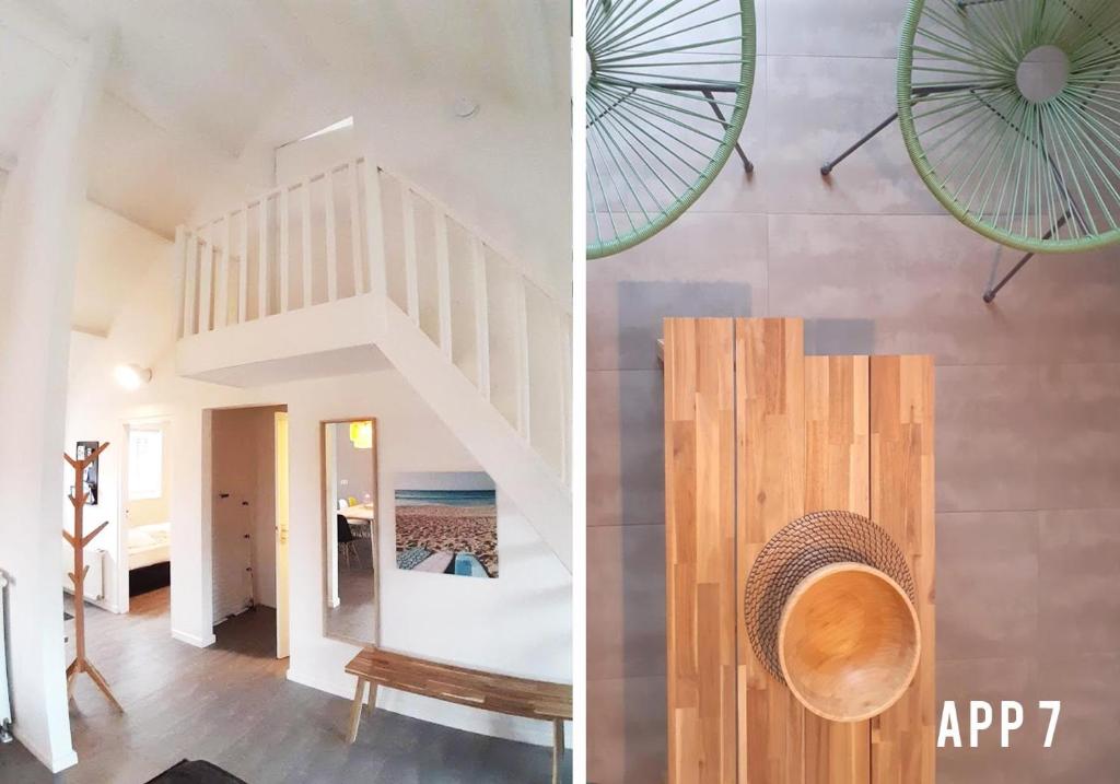 a staircase in a house with a view of the ocean at Tussen Dijken in Hollum