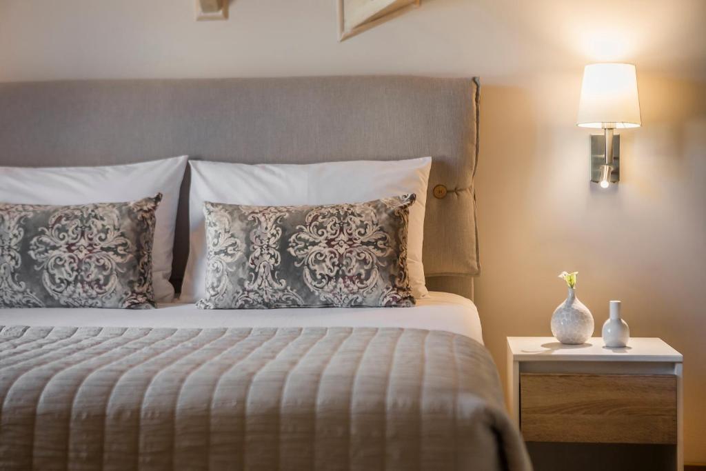 Posteľ alebo postele v izbe v ubytovaní Grand View Maisonette