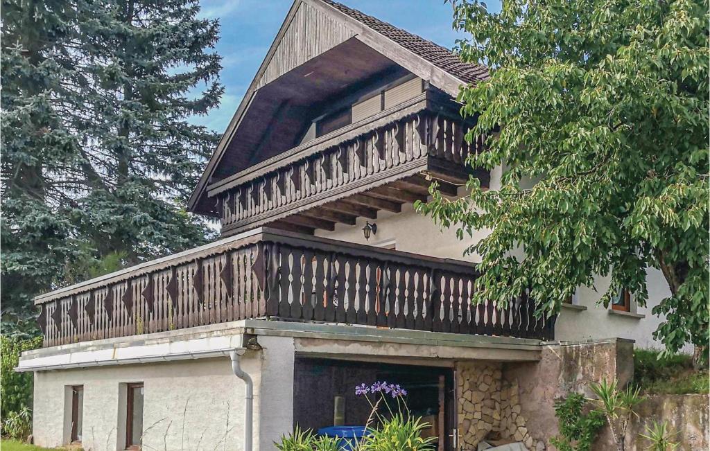 a house with a balcony on top of it at Nice Home In Wasungen With Wifi in Wasungen