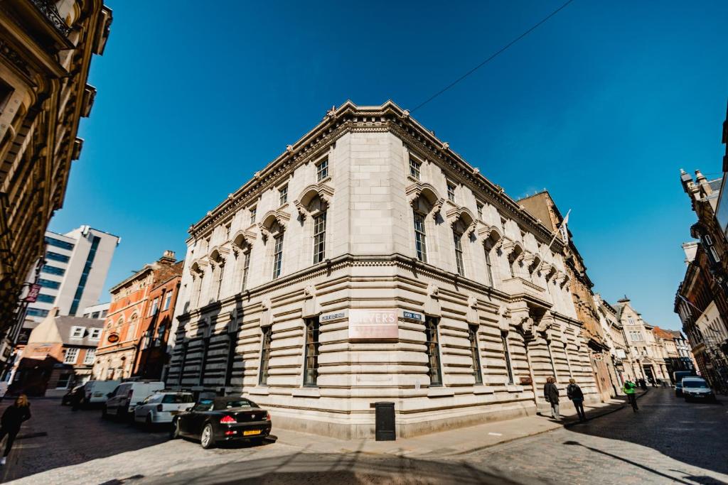 a large building on a street with cars parked in front at Green Ginger House in Hull