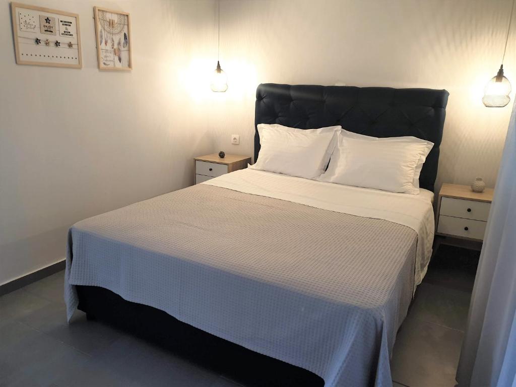 Ένα ή περισσότερα κρεβάτια σε δωμάτιο στο Neki's Apartments