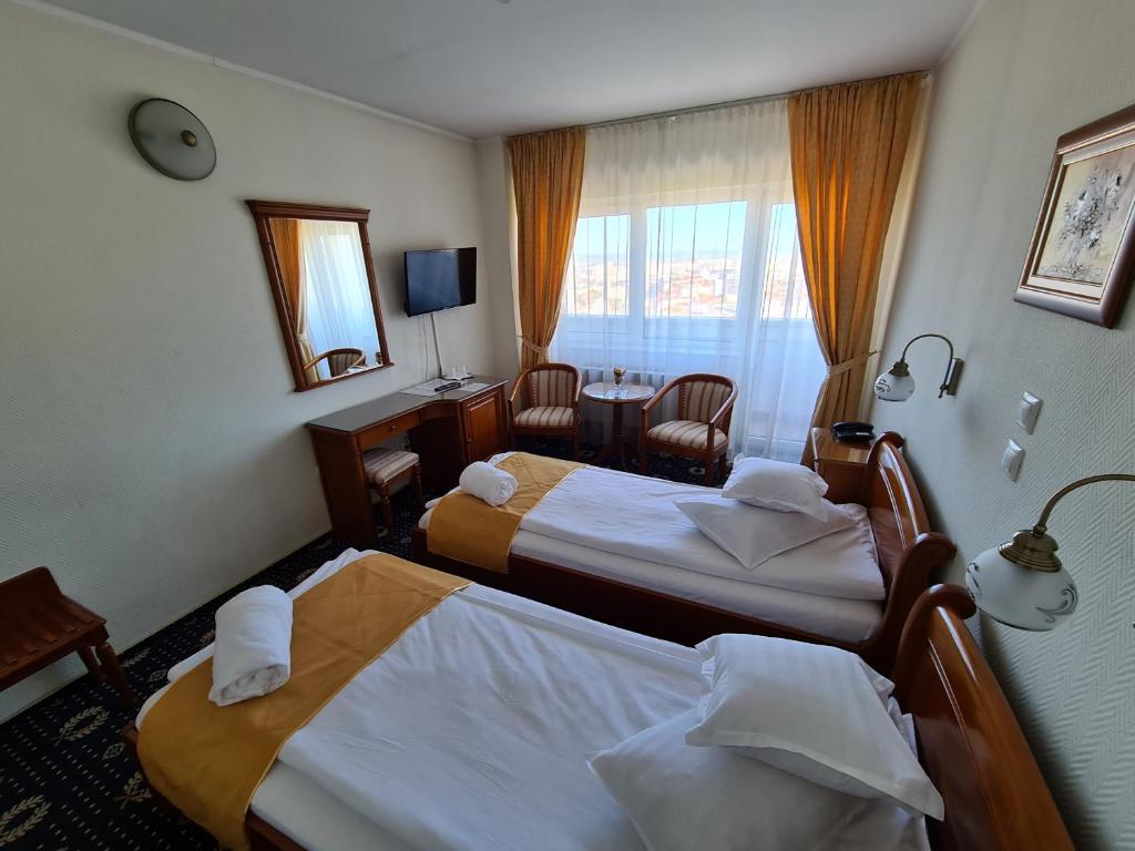 Postel nebo postele na pokoji v ubytování Hotel Belvedere
