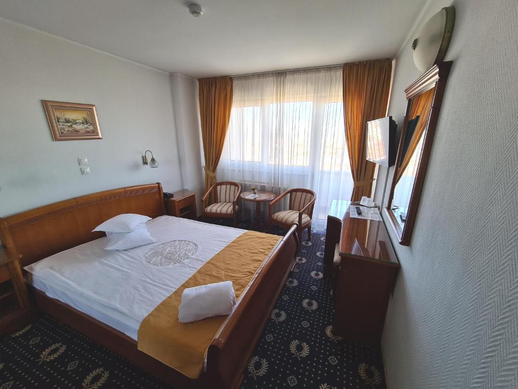 Postel nebo postele na pokoji v ubytování Hotel Belvedere