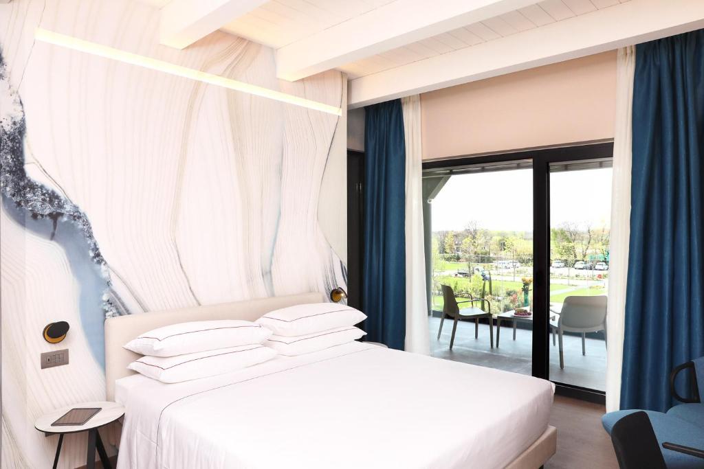 Postel nebo postele na pokoji v ubytování Hotel Veronesi La Torre