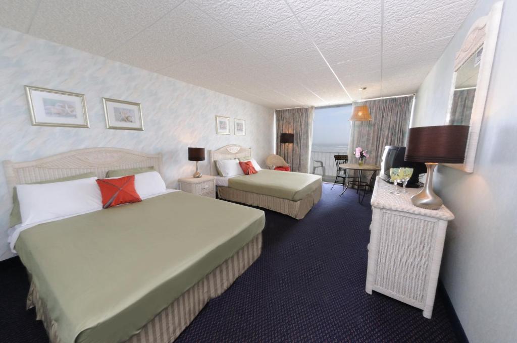Voodi või voodid majutusasutuse Bal Harbour Hotels toas