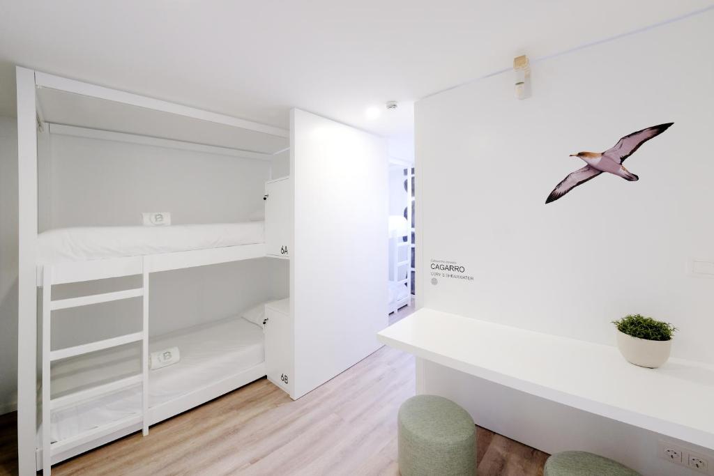 Postel nebo postele na pokoji v ubytování Boa Nova Hostel