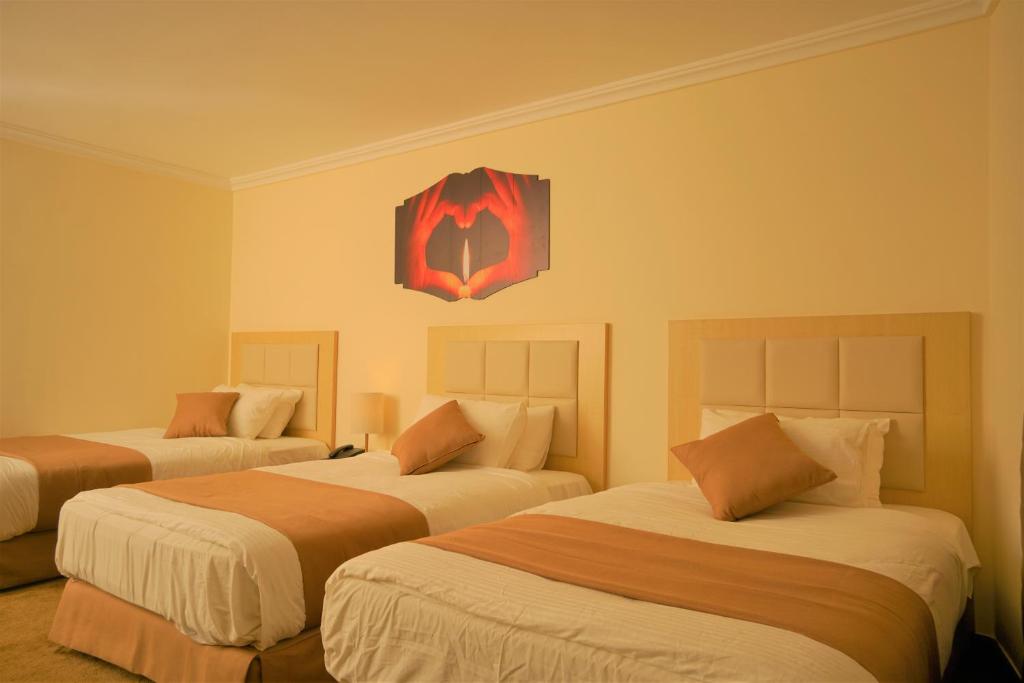 Postel nebo postele na pokoji v ubytování Silk Road Hotel