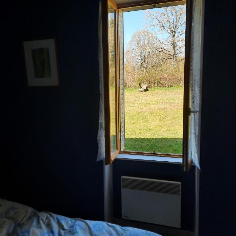Postel nebo postele na pokoji v ubytování Chambre d'hôte Le Châtaignier