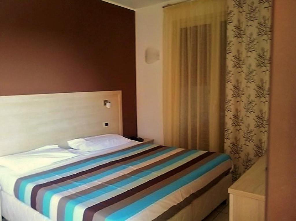 Postel nebo postele na pokoji v ubytování Hotel Bulla Regia