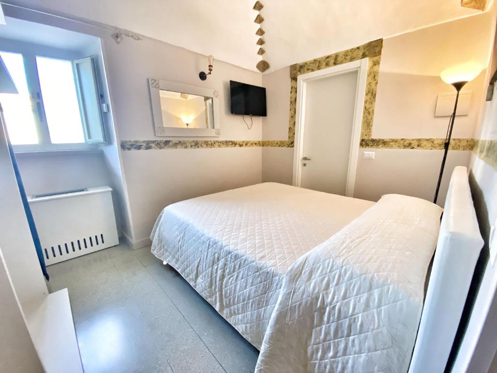 Postel nebo postele na pokoji v ubytování Porto Salvo