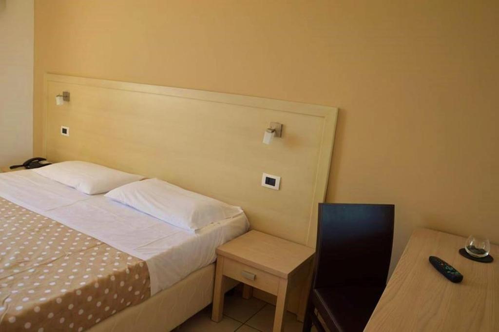 Postel nebo postele na pokoji v ubytování Hotel Bulla Regia