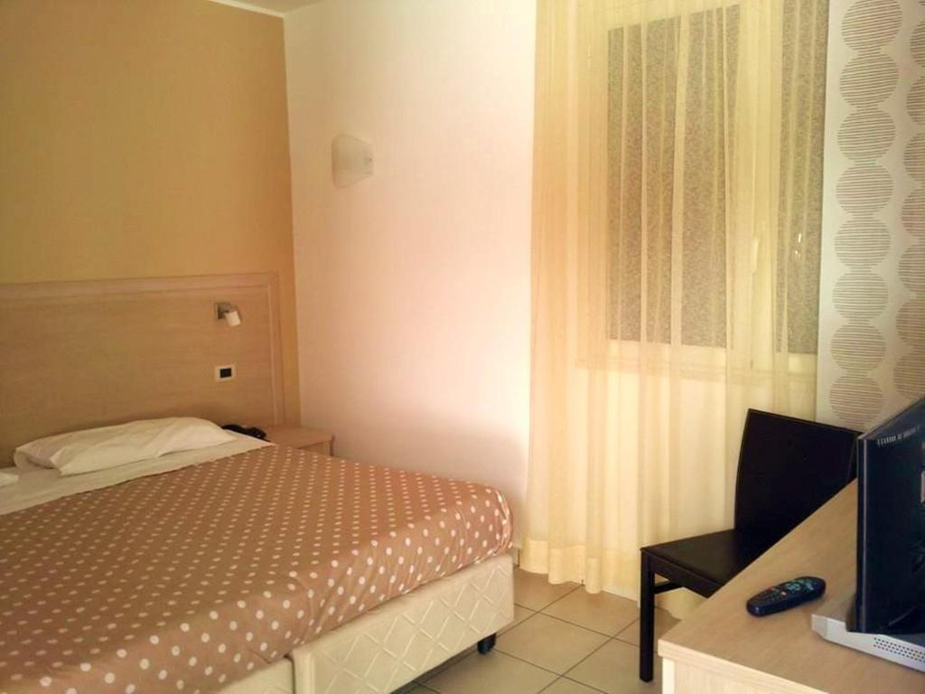 Postel nebo postele na pokoji v ubytování Hotel Bulla Regia