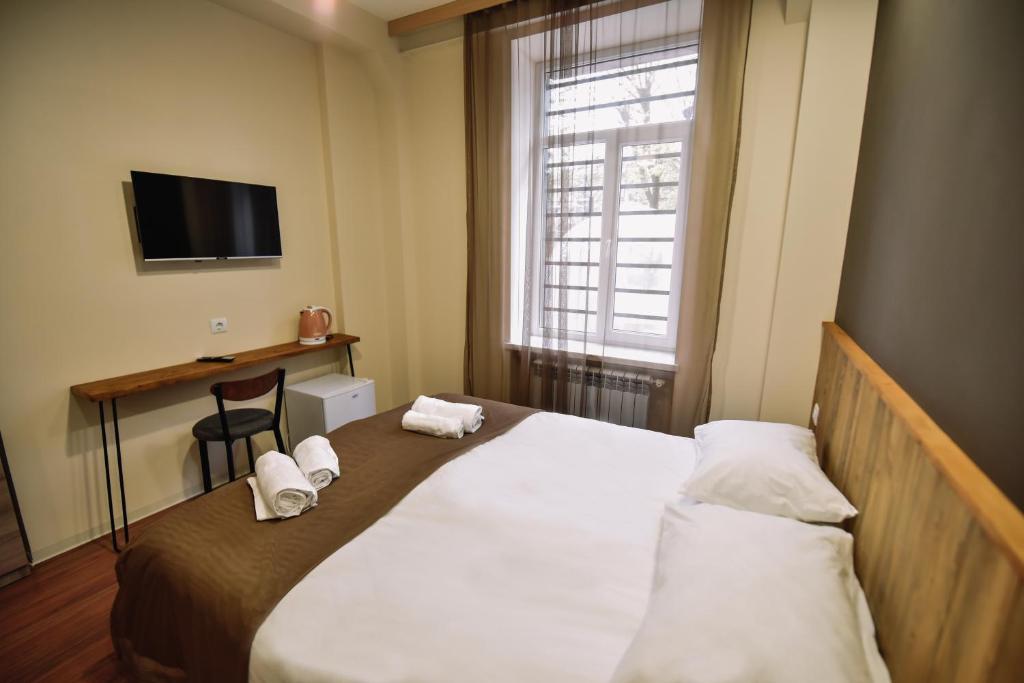 Postel nebo postele na pokoji v ubytování Lori Guest House Hotel
