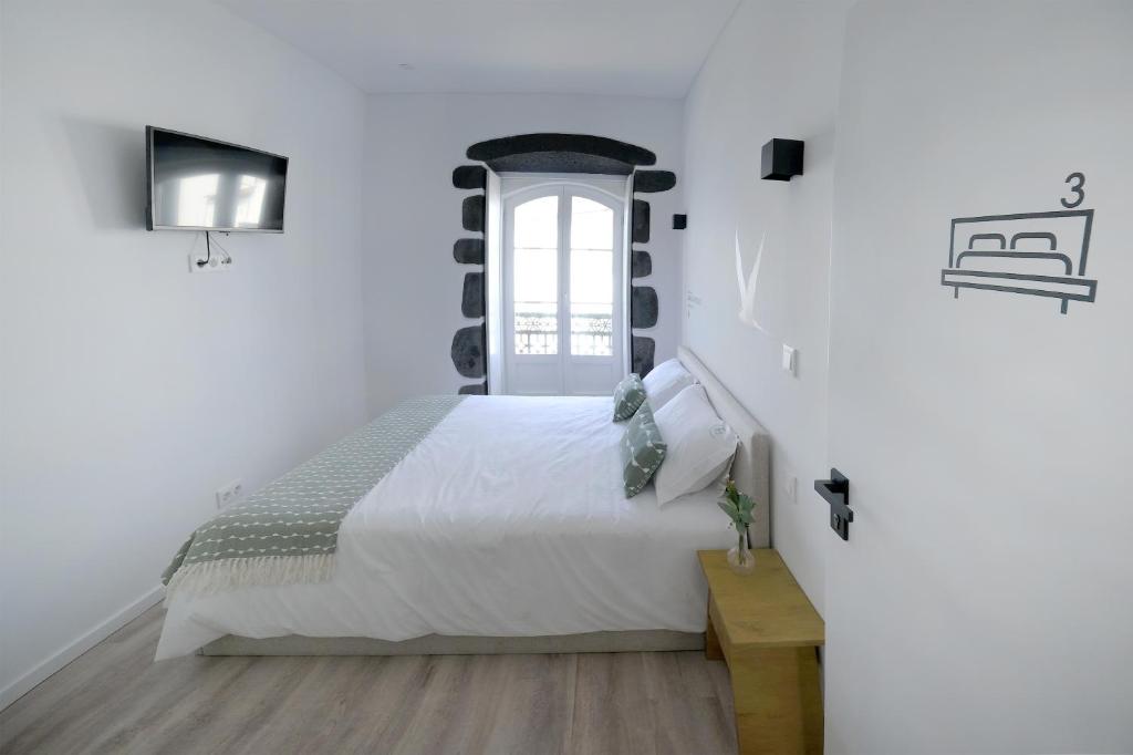 Postel nebo postele na pokoji v ubytování Boa Nova Hostel