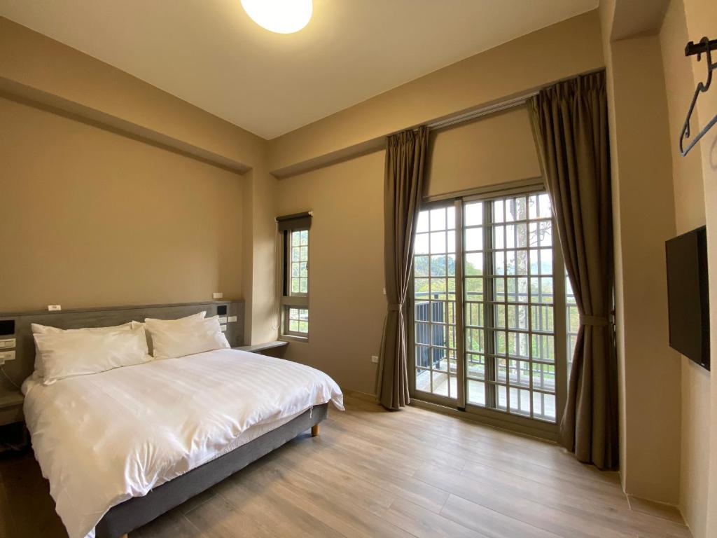 Postel nebo postele na pokoji v ubytování Sitou ARCADIA Homestay