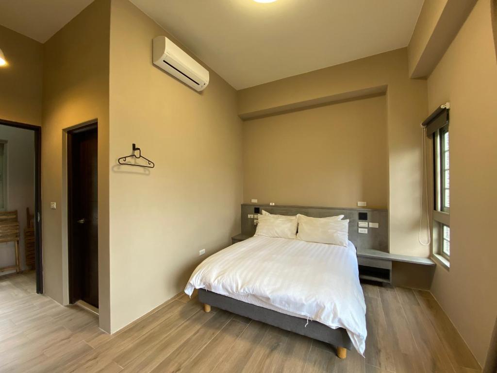 Postel nebo postele na pokoji v ubytování Sitou ARCADIA Homestay
