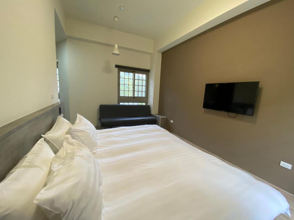 Postel nebo postele na pokoji v ubytování Sitou ARCADIA Homestay