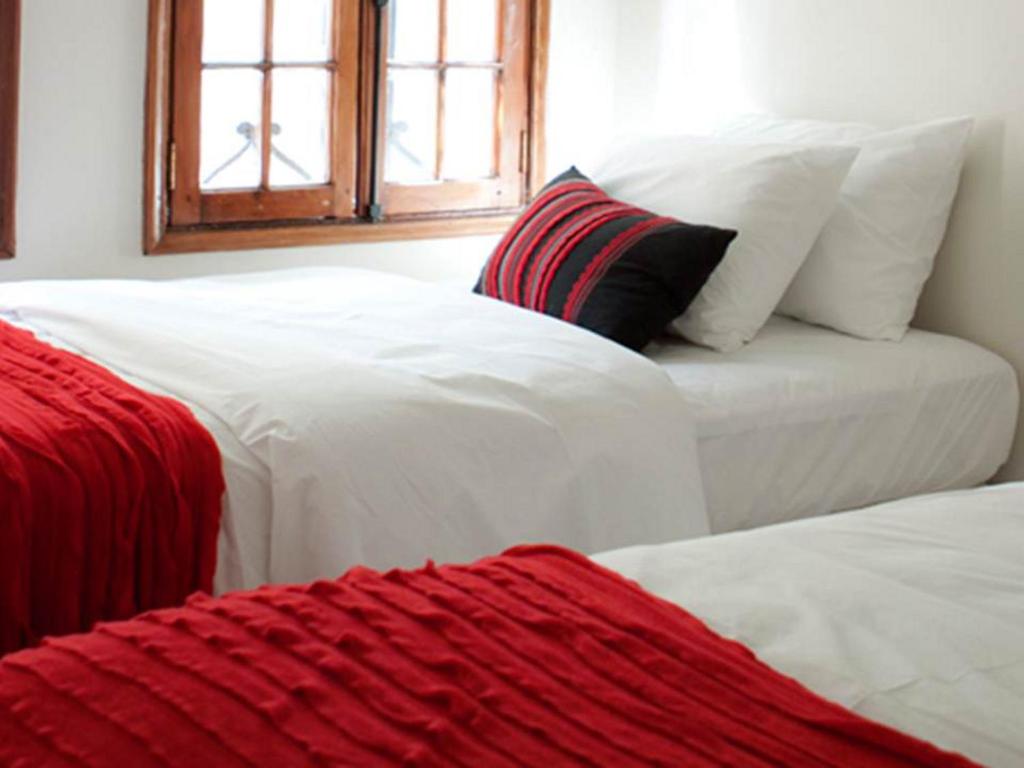 Postel nebo postele na pokoji v ubytování Hotel CasaDeTodos