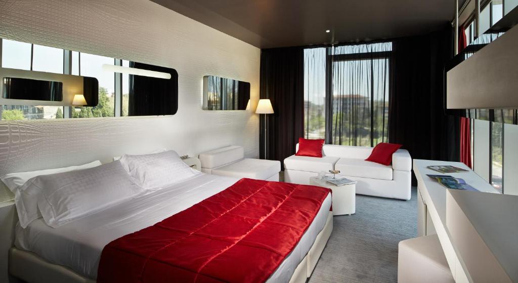 Postel nebo postele na pokoji v ubytování San Ranieri Hotel