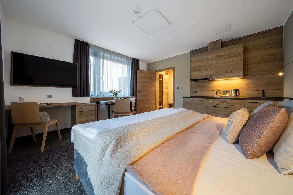 Postel nebo postele na pokoji v ubytování Hotel Zelený potok
