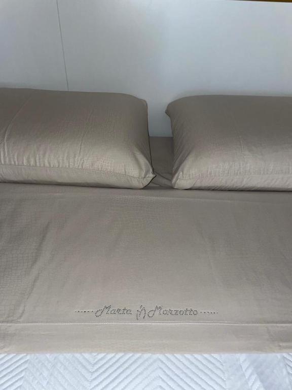 A bed or beds in a room at La Nicchia