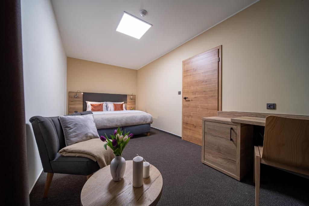 Postel nebo postele na pokoji v ubytování Hotel Zelený potok