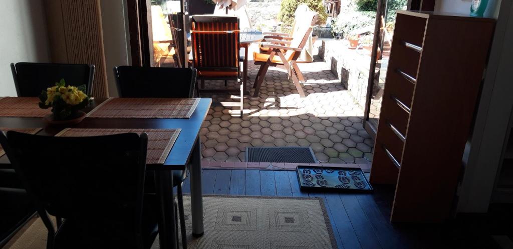 a dining room with tables and chairs and a patio at Ubytovanie v Banskej Štiavnici u Antalov in Banská Štiavnica