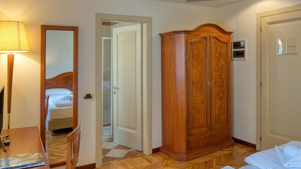 Postel nebo postele na pokoji v ubytování Hotel Galeazzi