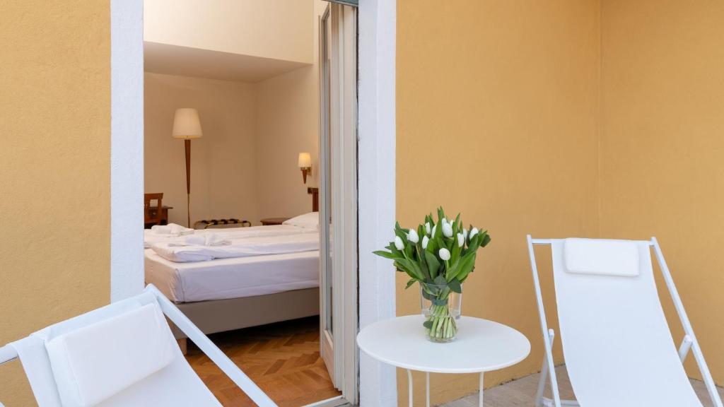 Postel nebo postele na pokoji v ubytování Hotel Galeazzi