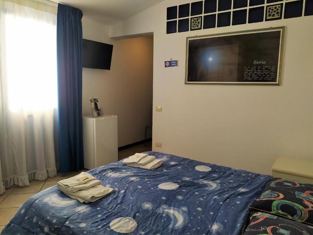 Postel nebo postele na pokoji v ubytování B&B Luna Blu