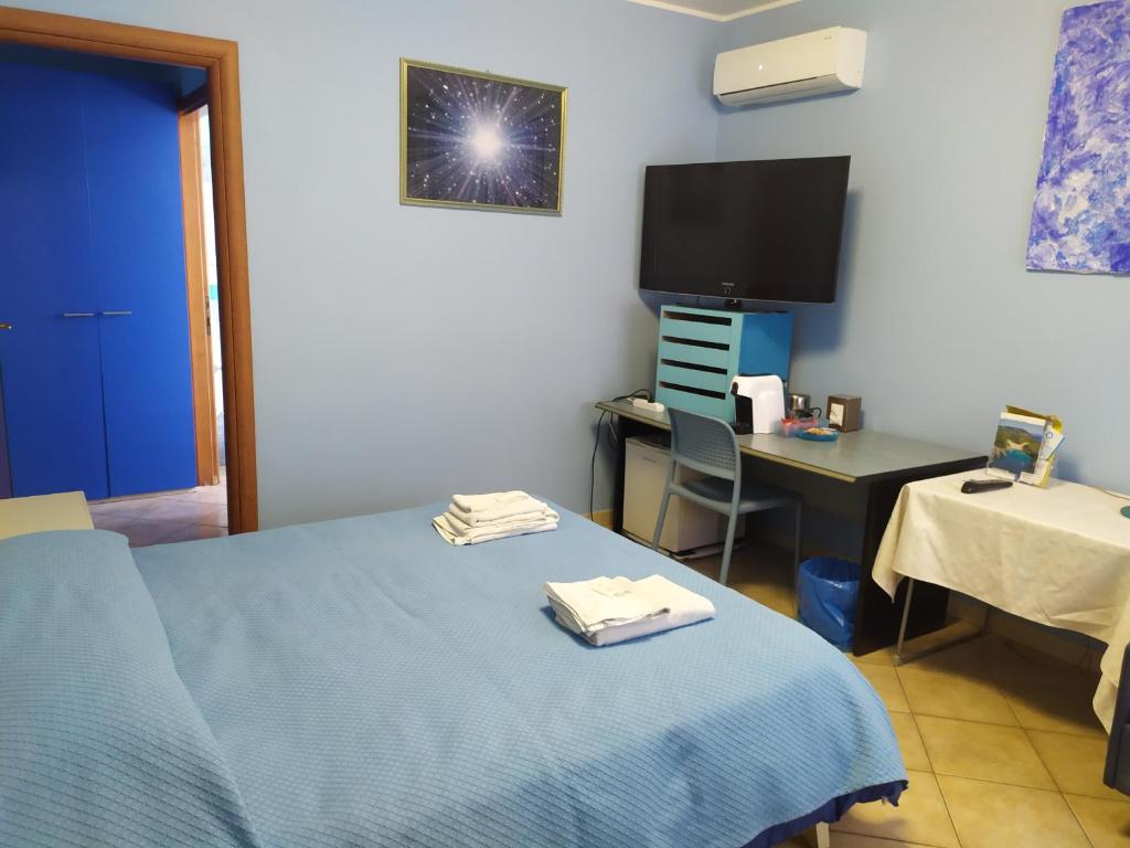 Postel nebo postele na pokoji v ubytování B&B Luna Blu