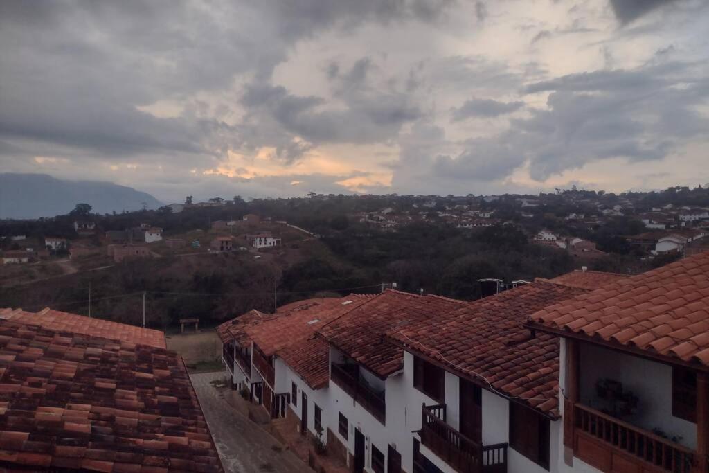 a view of a town with roofs of buildings at Kasazha- Casa entera en Barichara 3 habitaciones. in Barichara